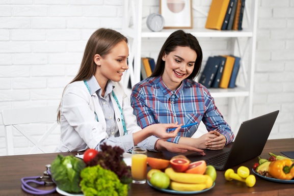 Nutritionist with Fresh Vegetables - Professional Consultation